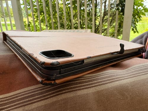 Customer's Custom Magic Keyboard Book-Style iPad Case showing peeling edges on the tan synthetic cover.