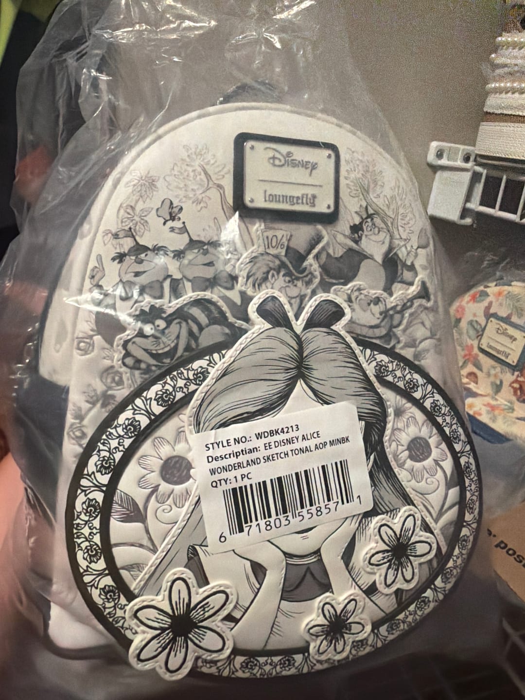 Customer photo review of Loungefly Disney Alice in Wonderland Sketch Mini Backpack - Entertainment Earth EX