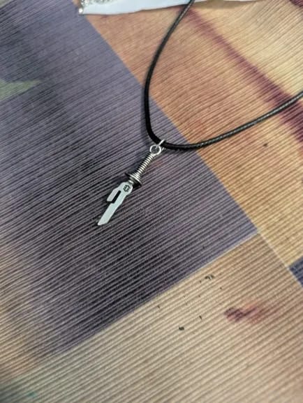 Customer photo review of Collar "Lanza Invertida"