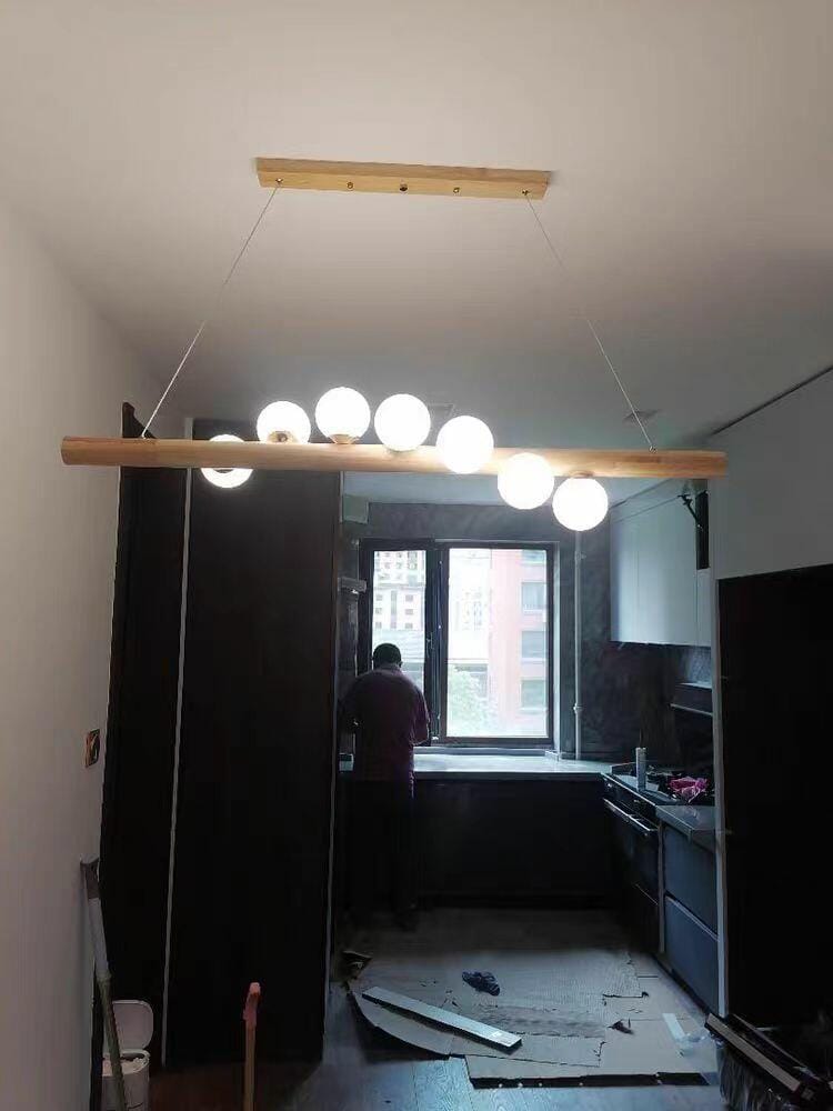 Customer photo review of Linear Wood Pendant Light, Walnut Bar, Opal Glass Globes, G9