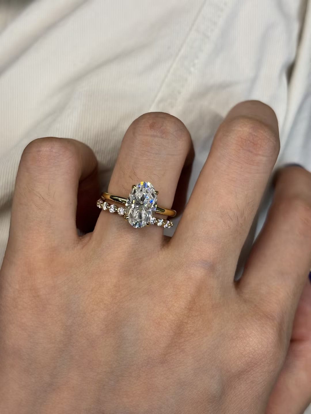 Customer photo review of Moissanite 3.0Ct~4.0Ct Hidden Halo Oval Cut Yellow Gold Engagement Ring with 1.5Ct Round Cut Wedding Band