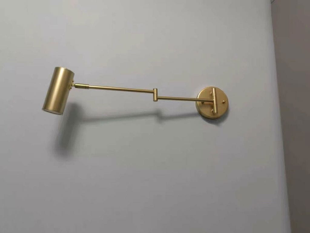 Customer photo review of Swing Arm Wall Sconce, Adjustable Iron Arm, Integrated LED, Gold