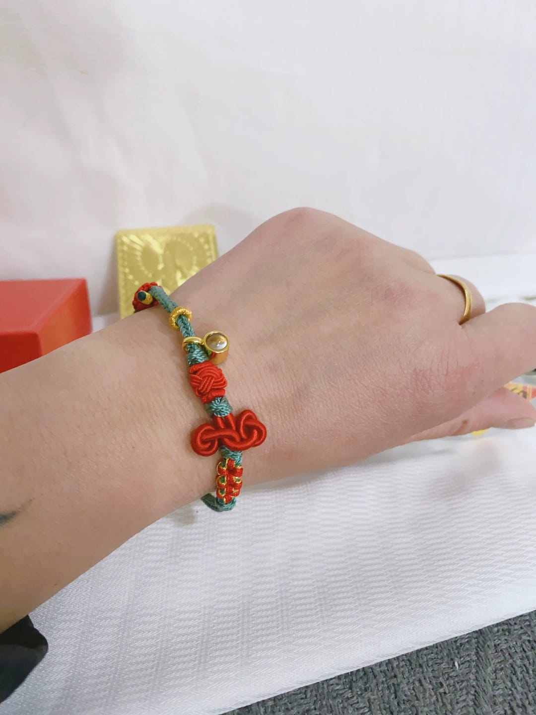 Customer photo review of FuAttract Good Luck Wisdom & Success Wenchang Knot Handmade Red String Bracelet