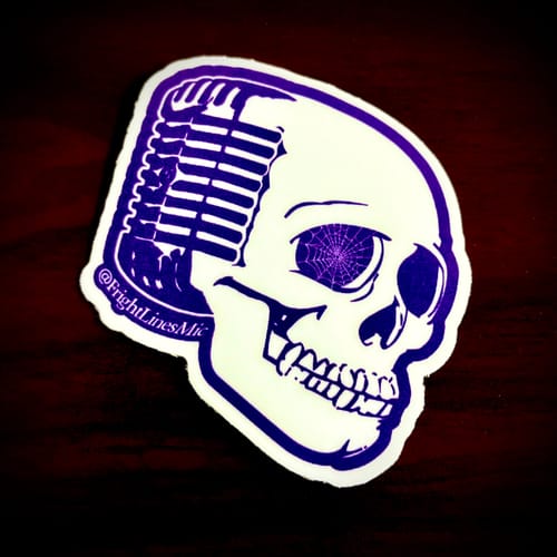 Customer's custom vinyl sticker featuring a white skull with a microphone design and spiderweb detail on a dark surface