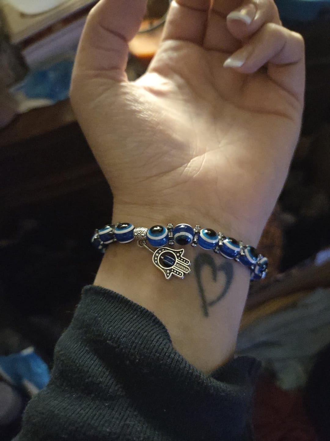 Customer photo review of FuAttract Protection Luck & Balance Hamsa Hand Evil Eye Charm Spiritual Bracelet