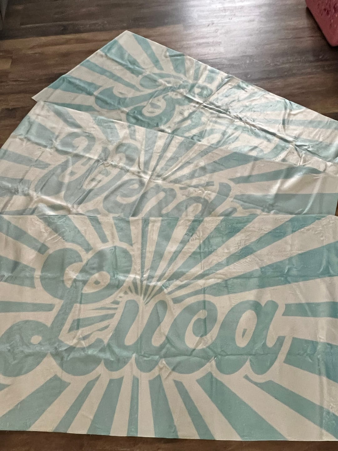 Customer photo review of Retro Burst Personalized Beach Towel: Custom Name Pool Towel