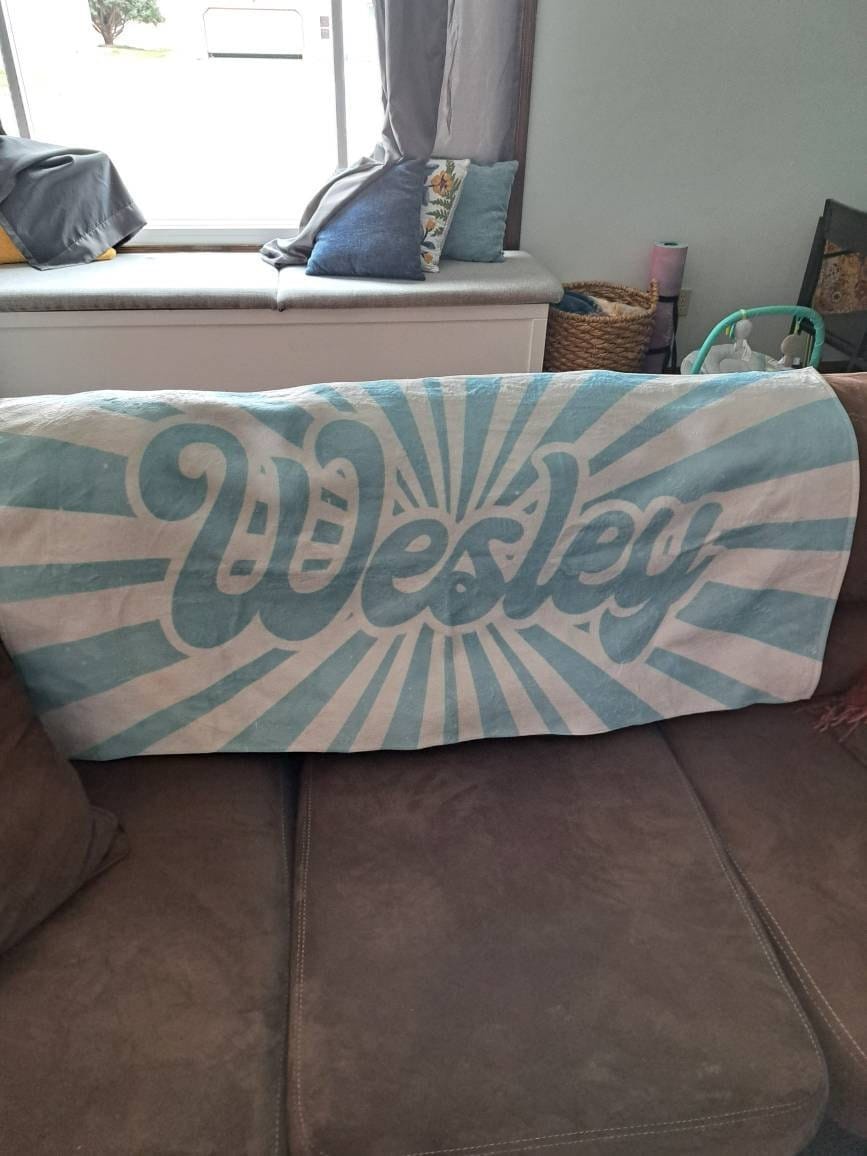 Customer photo review of Retro Burst Personalized Beach Towel: Custom Name Pool Towel