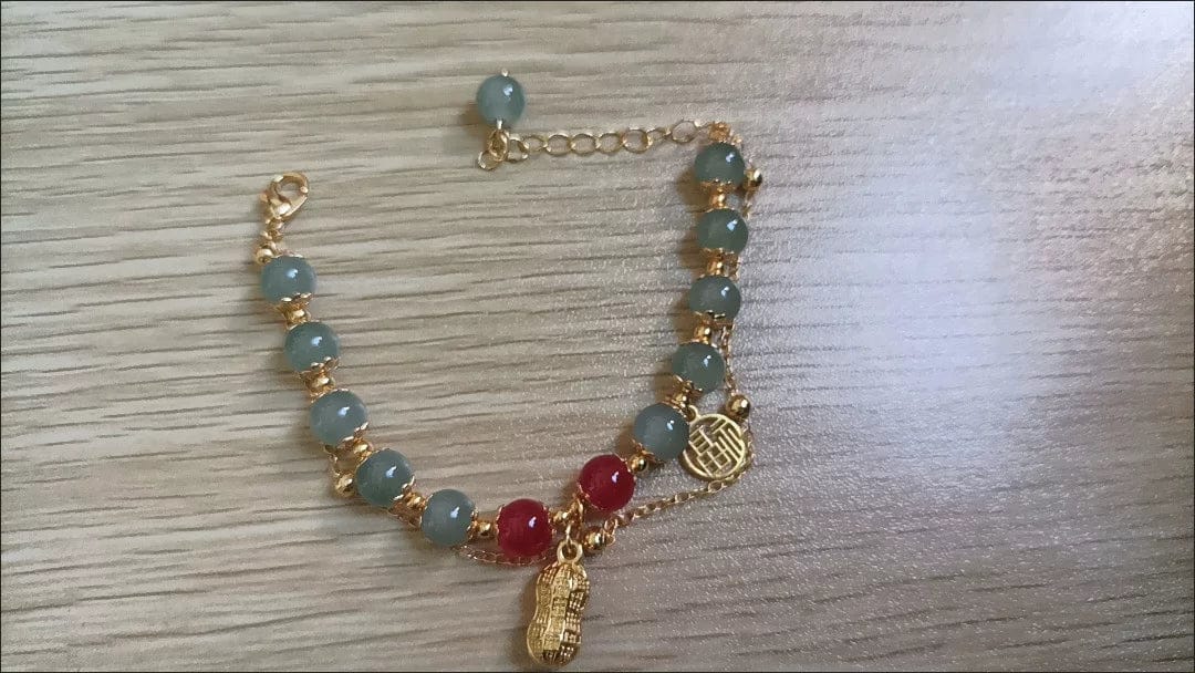 Customer photo review of FuAttract Good Fortune & Prosperity Hetian Jade Peanut Charm Double Layer Luck Bracelet