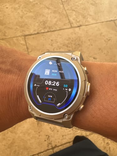 Reviewer's Gard Pro Ultra 3 on their wrist, showing a digital circular watch face with activity metrics.