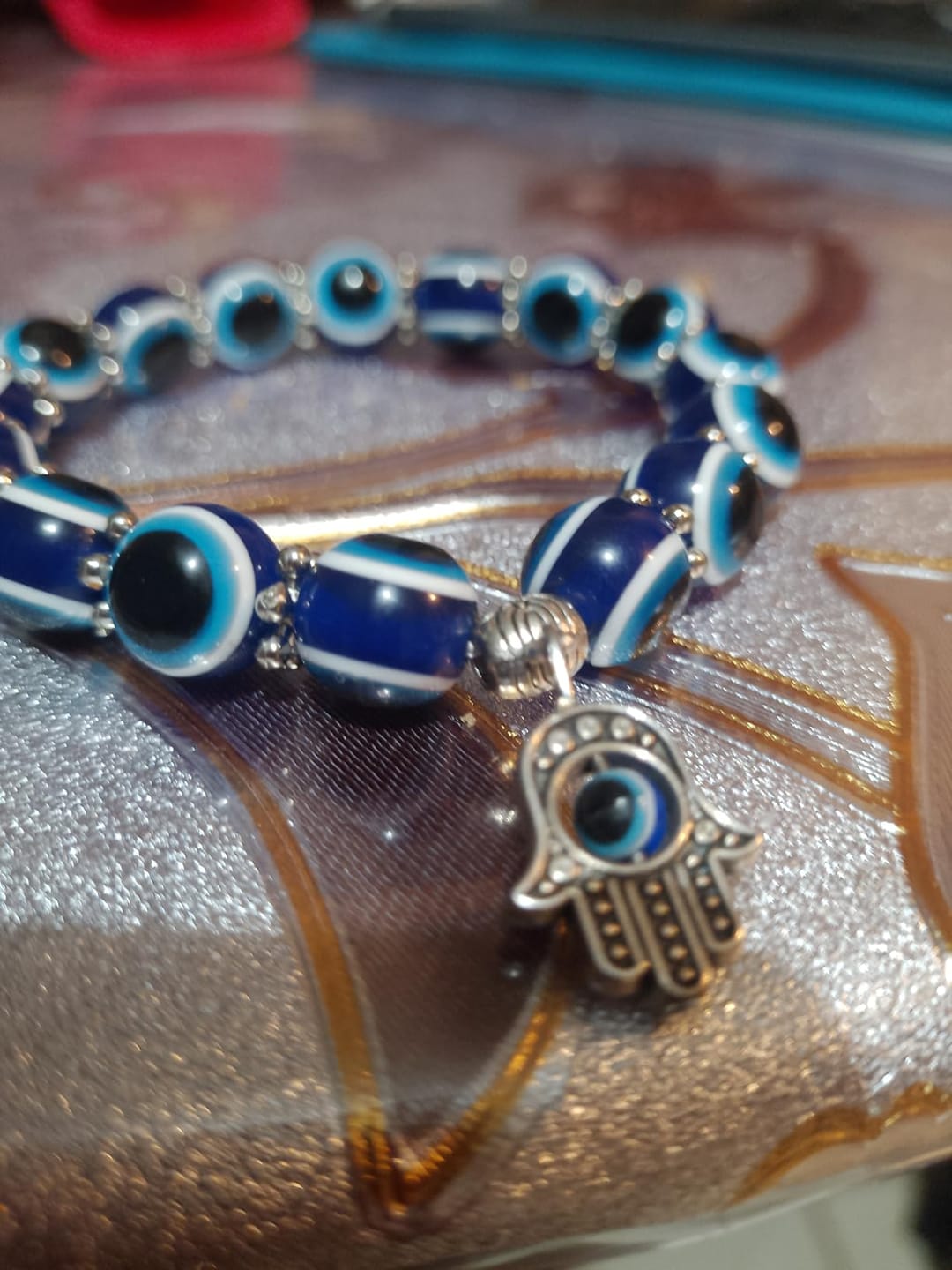 Customer photo review of FuAttract Protection Luck & Balance Hamsa Hand Evil Eye Charm Spiritual Bracelet