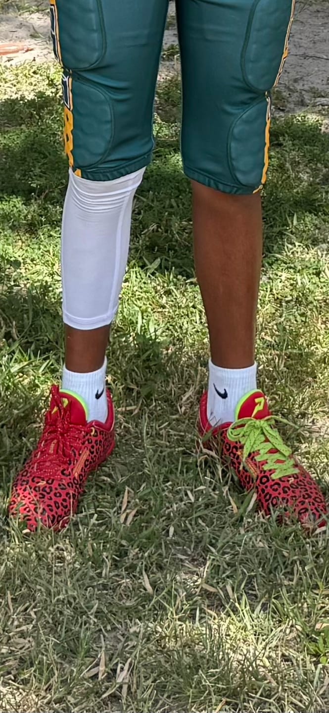 Customer photo review of Phenom Elite Quantum Carbon Football Cleats – Red Leopard