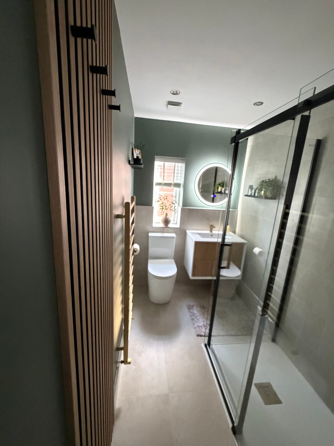 Customer photo review of SlatWall Waterproof Natural Oak and Black Wall Panel