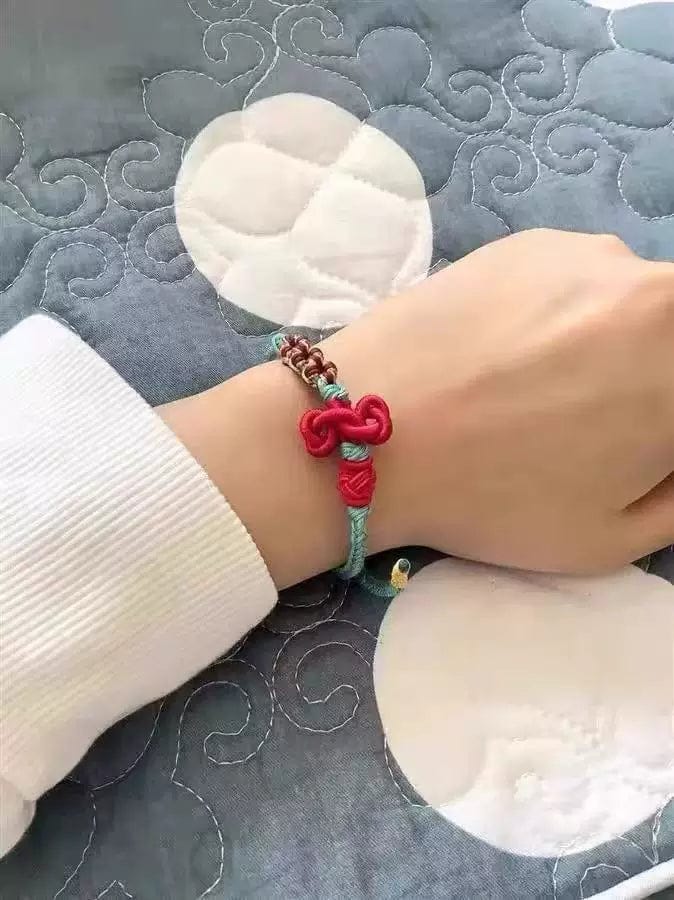 Customer photo review of FuAttract Good Luck Wisdom & Success Wenchang Knot Handmade Red String Bracelet