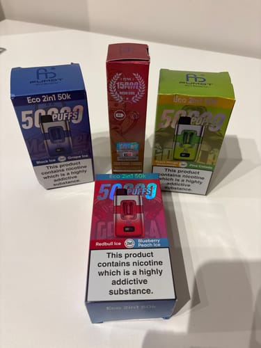Customer's four Fumot Eco 2 in 1 50000 Puffs disposable vape boxes arranged on a white surface.