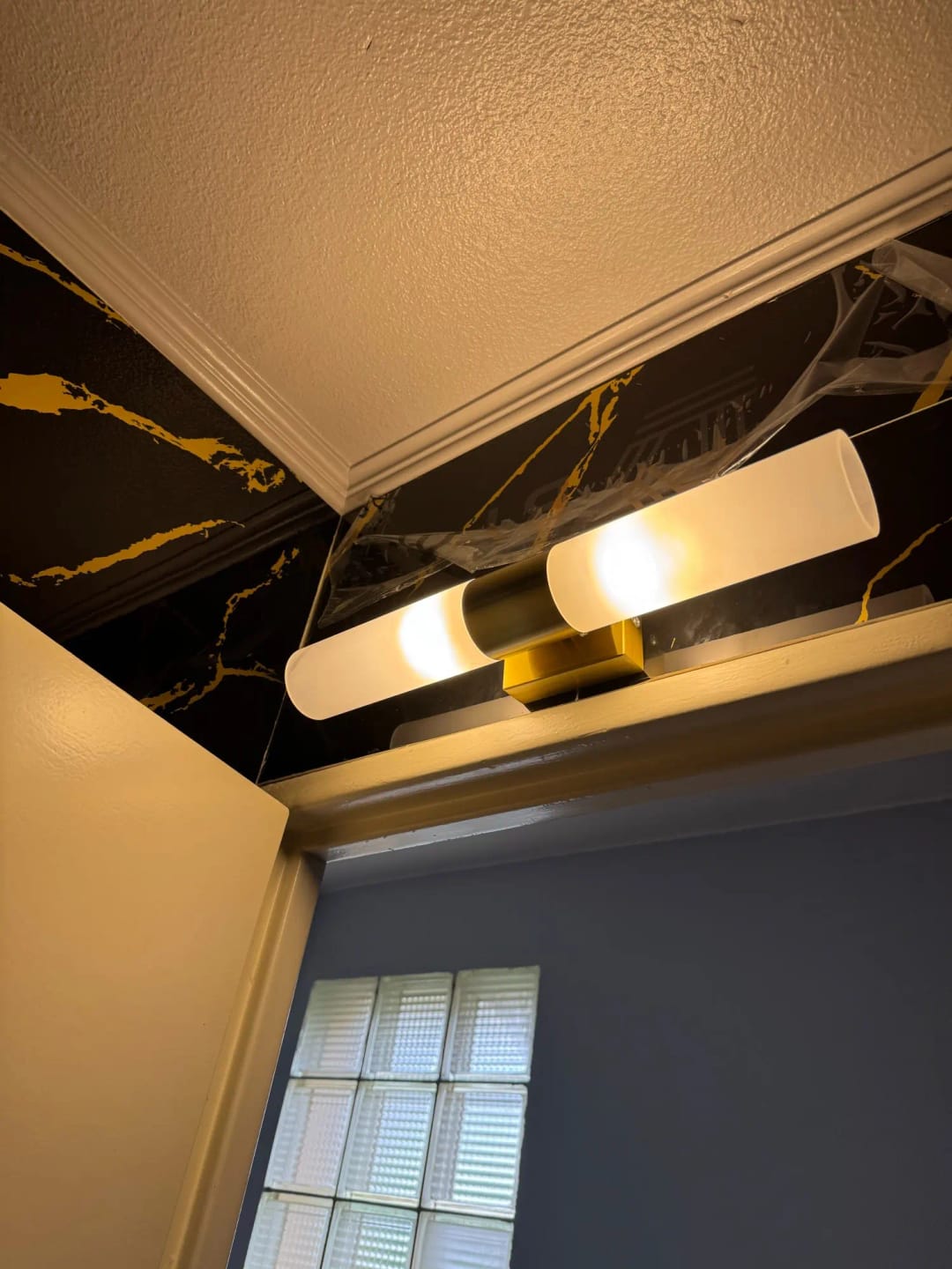 Customer photo review of Antique Brass Wall Sconce With Rippled Glass Shade, LED Light