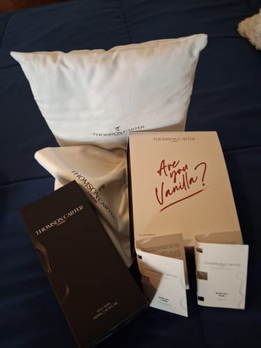 Customer's Are You Vanilla? fragrance set in packaging, including a cream-colored pillow and various branded boxes.