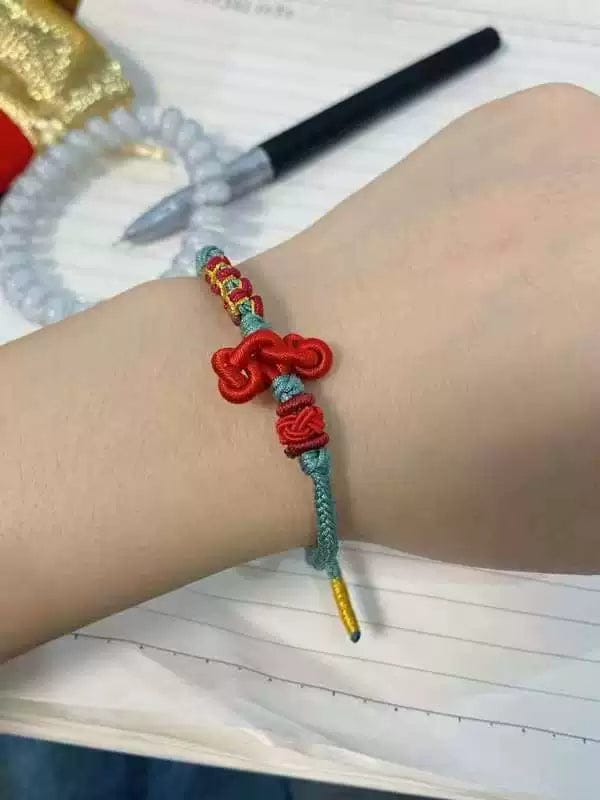 Customer photo review of FuAttract Good Luck Wisdom & Success Wenchang Knot Handmade Red String Bracelet