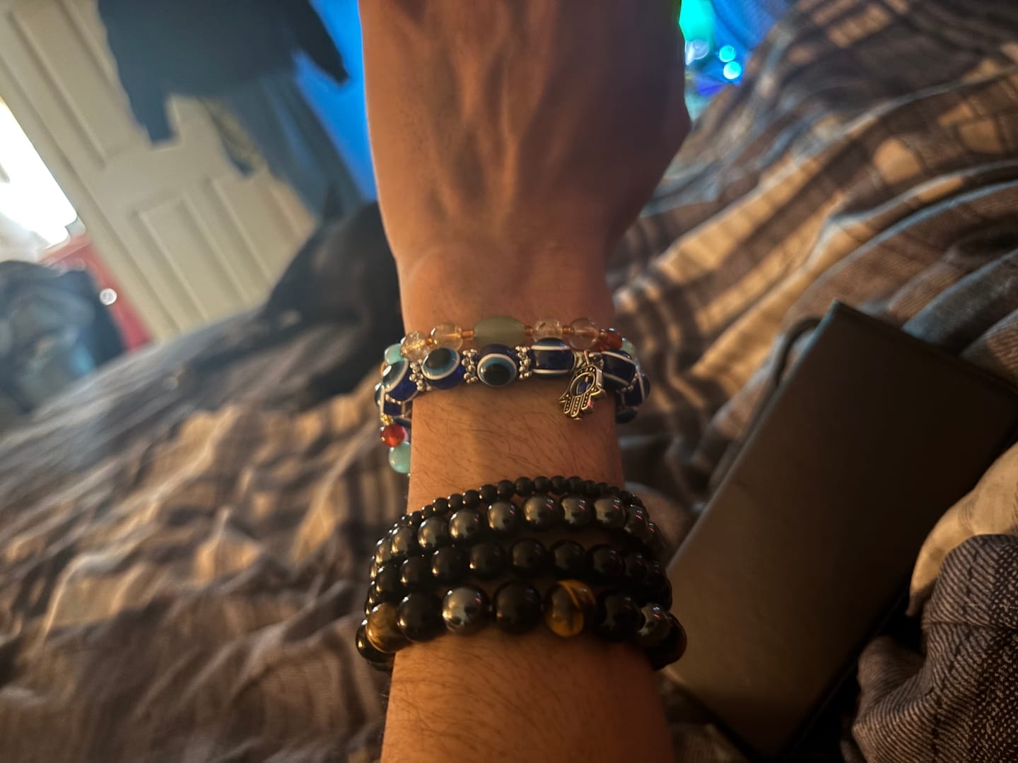 Customer photo review of FuAttract Protection Luck & Balance Hamsa Hand Evil Eye Charm Spiritual Bracelet