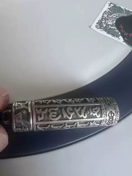Customer photo review of FuAttract Protection & Harmony Shurangama Mantra Om Mani Mantra Cinnabar Locket Pendant Necklace