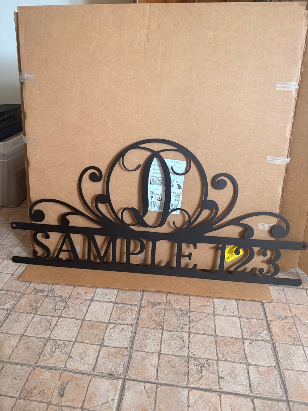 Customer photo review of Scroll Family Name - Steel Sign