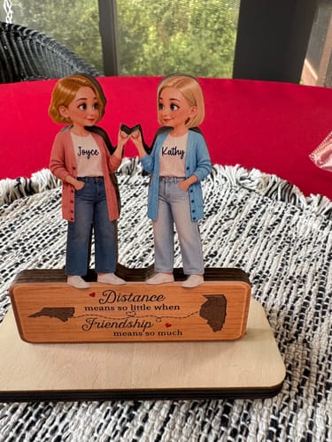 Customer's wooden plaque featuring two cartoon best friends sharing a pinky promise and a long distance message.