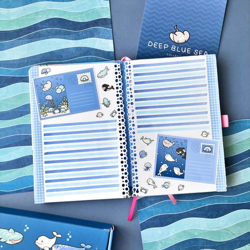 Customer's Deep Blue Sea Bonus Box Set open to a blue-themed journal with sea creature stickers.
