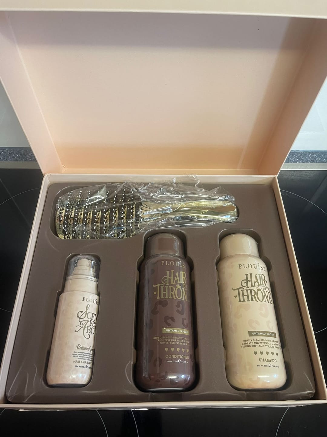 Customer photo review of Cheetah Claim To Tame Hair Care Set