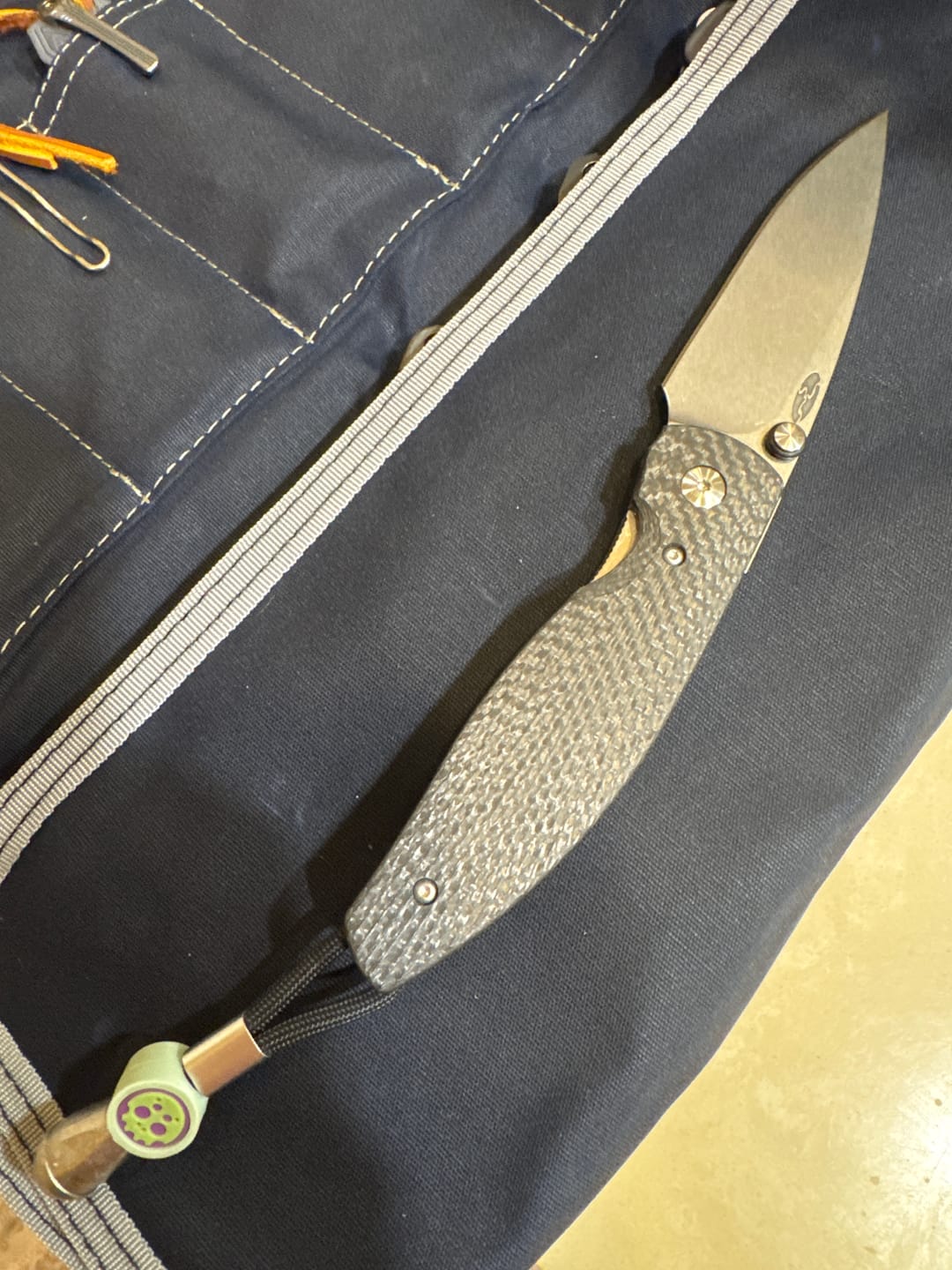 Customer photo review of The Back Door: TRM ATOM Liner Lock - CPM-MagnaCut, Carbon Fiber 3D Sunburst, Titanium Liners - Made in USA (DLR-ATM-CF-SB) (Blem)