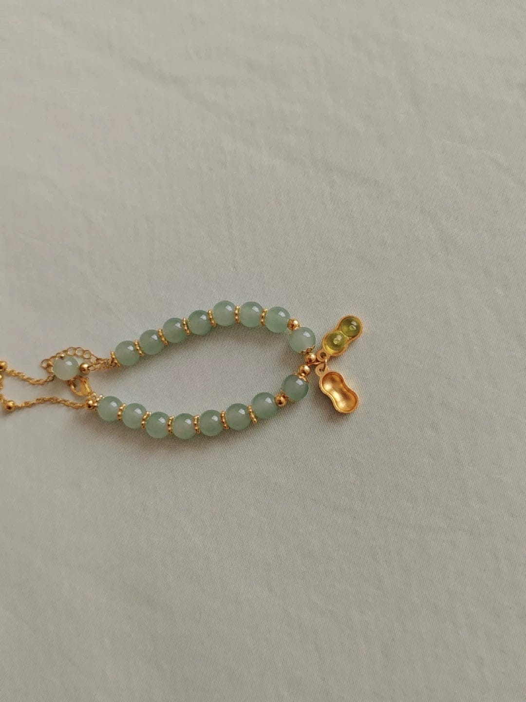 Customer photo review of FuAttract Good Fortune & Prosperity Hetian Jade Peanut Charm Double Layer Luck Bracelet