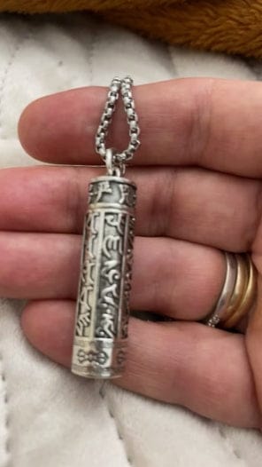Customer photo review of FuAttract Protection & Harmony Shurangama Mantra Om Mani Mantra Cinnabar Locket Pendant Necklace