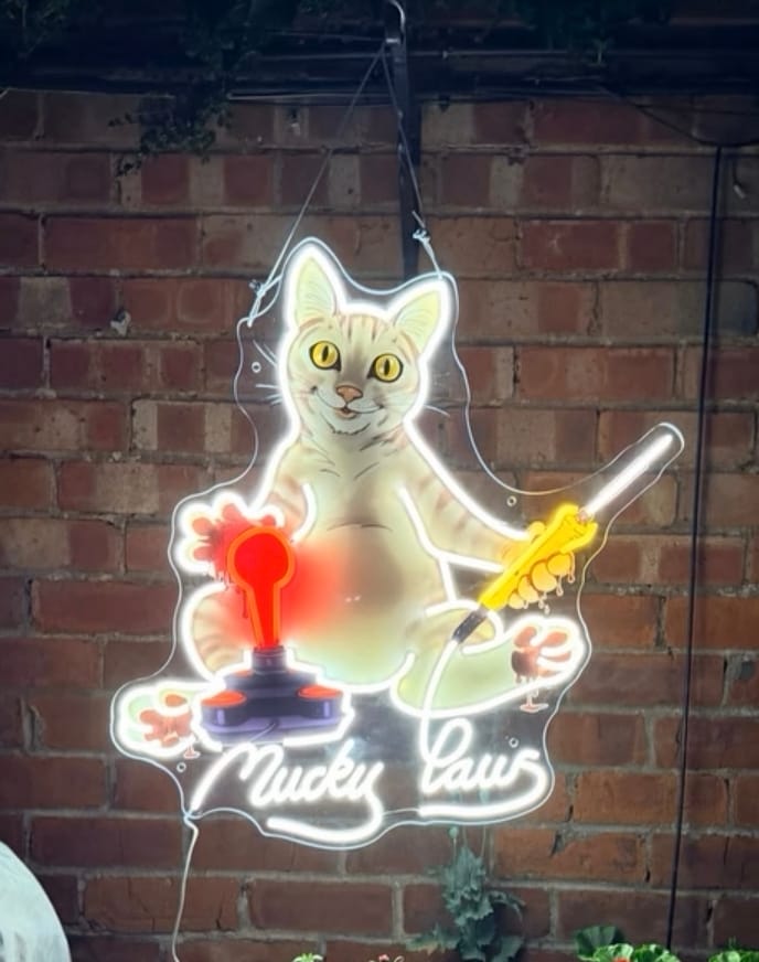 Customer photo review of 3 Tabletop Signs + 10 Keychains