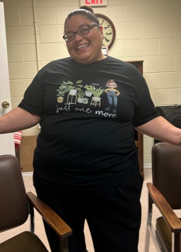 Customer's Just One More Plants Personalized T Shirt in black with a custom plant-themed graphic.