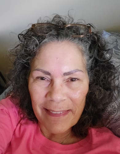 Reviewer showing their clear, glowing skin after using the Collagen Cleanser.