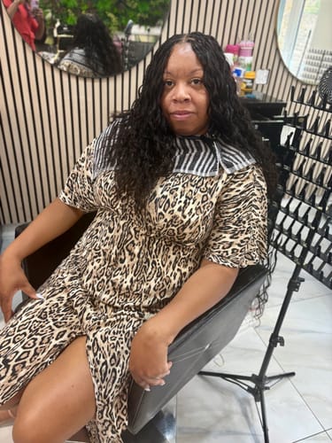 Customer's Loose Wave Human Crochet Hair installed, showing a voluminous, dark brown wavy style on a person.