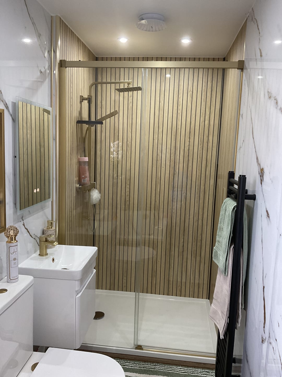 Customer photo review of Sivara Oak Slatted Wood Effect PVC Waterproof Shower Panel