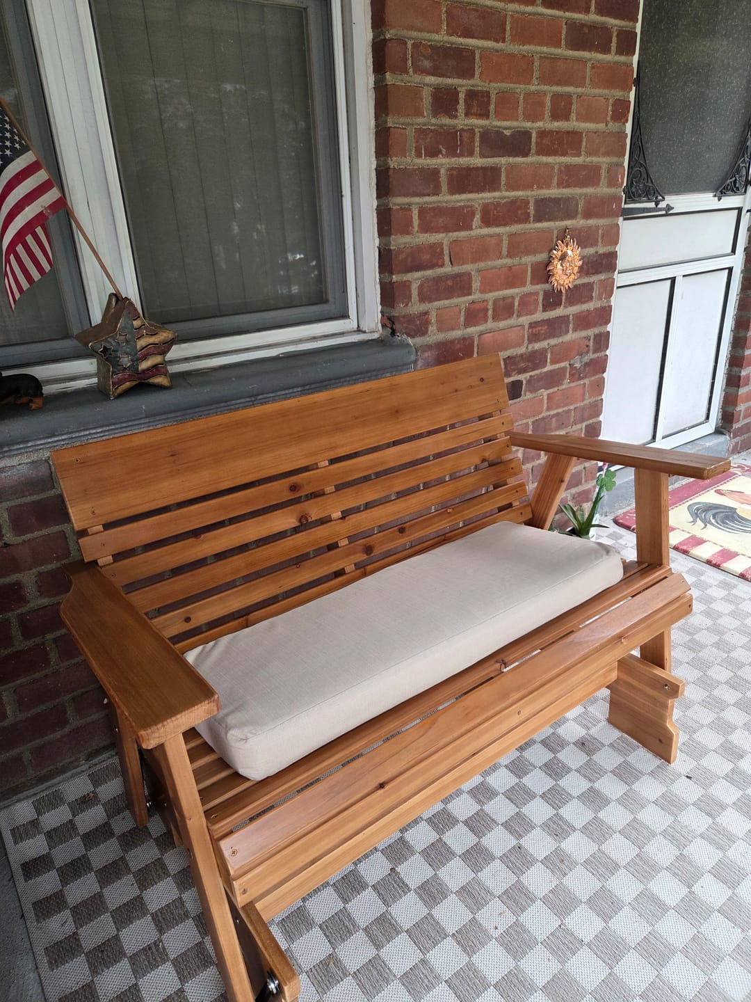 Customer photo review of Homrest Wooden Patio Glider Bench with Cup Holders Heavy Duty 900lbs