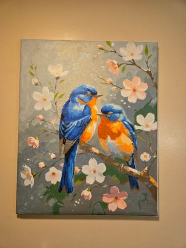 Reviewer's finished Custom Paint by Numbers pet portrait, featuring two vibrant blue birds on a cherry blossom branch.