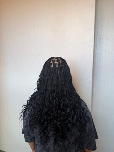 Customer's back view of the installed Miracle Knots Crochet Hair showing the wavy texture and braided roots.