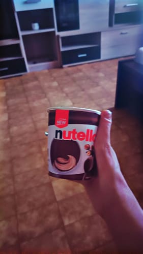 Customer's hand holding a Nutella container instead of the expected THC-A Biscotti Mintz flower product.
