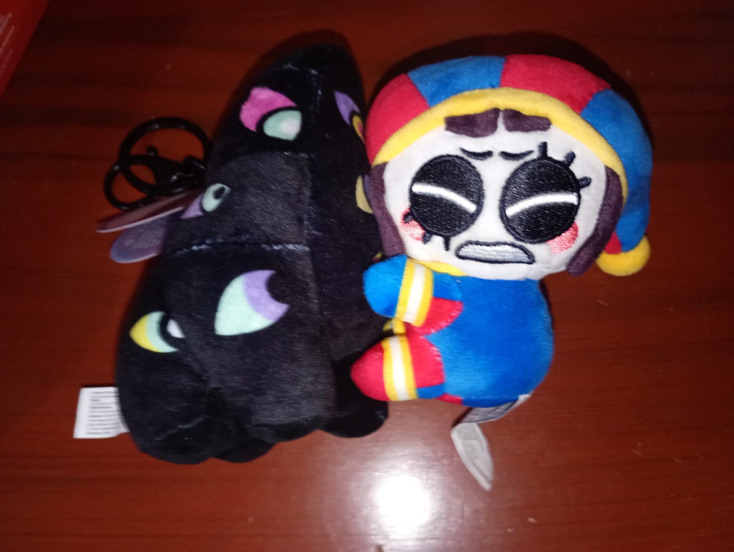 Customer photo review of Pomni & Abstraction Magnetic Plush Keychains