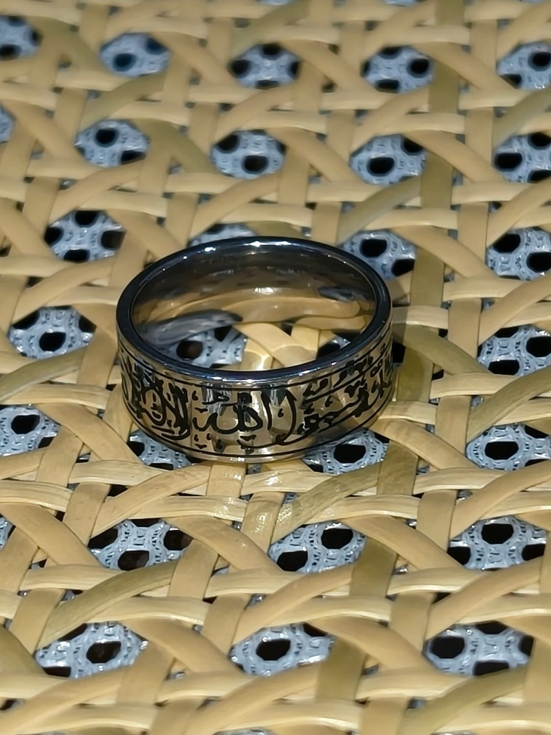 Customer photo review of HilalHaven Devotion Shahada Engraved Spinner Ring — Polished Titanium Steel