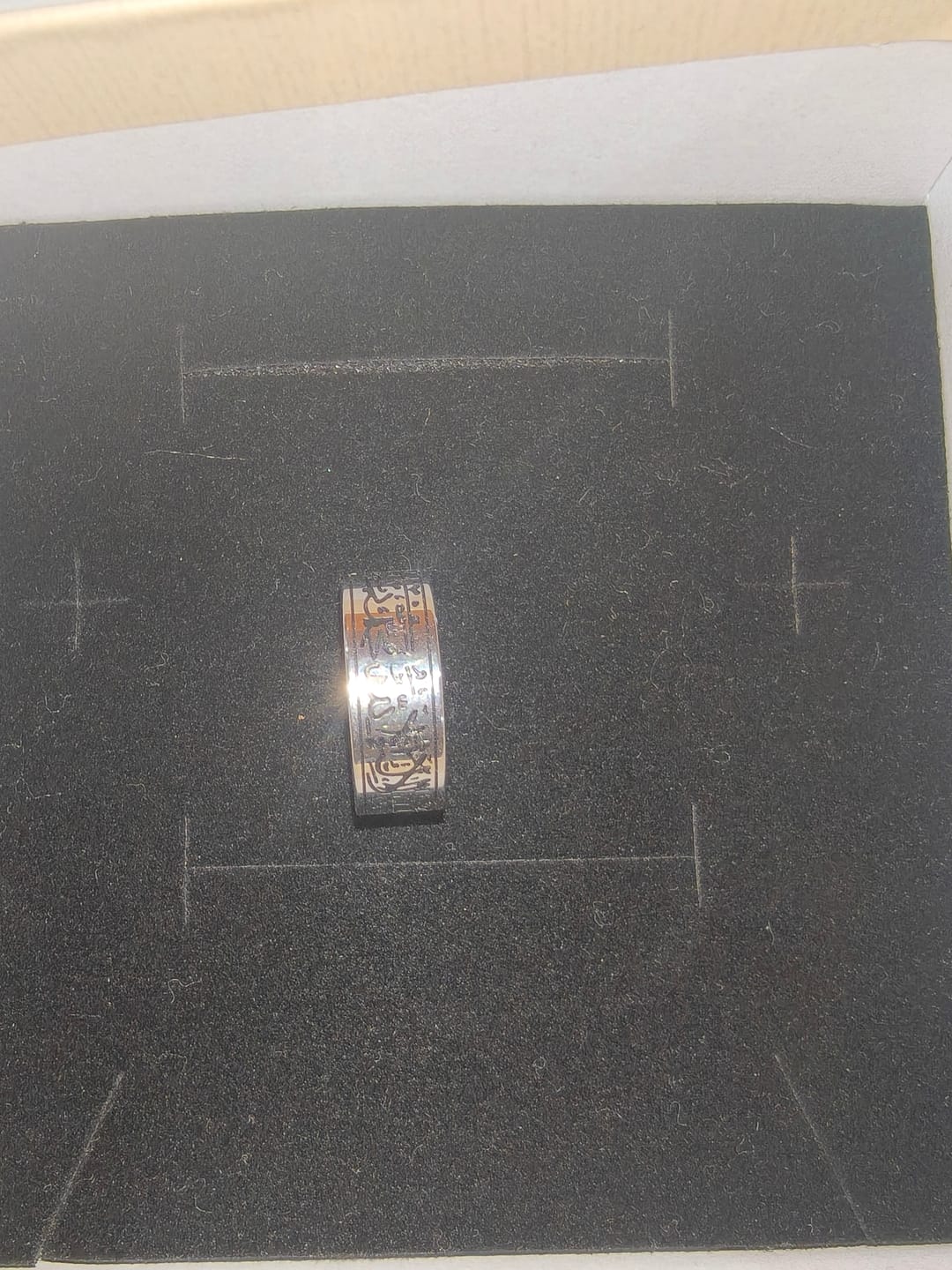Customer photo review of HilalHaven Devotion Shahada Engraved Spinner Ring — Polished Titanium Steel
