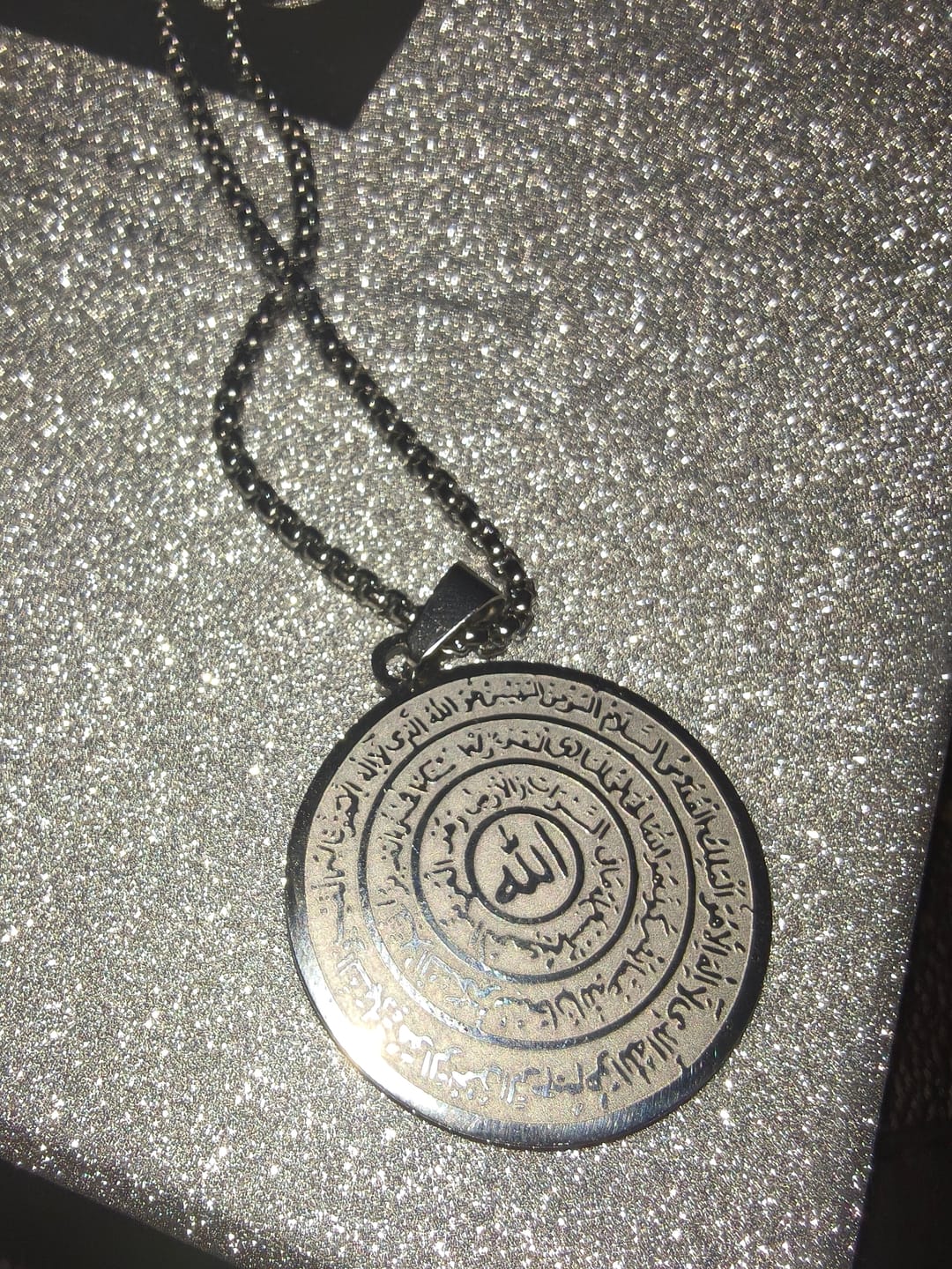 Customer photo review of HilalHaven Polished Round‑Disc with Circling Quranic‑Ayatul Kursi Verse Allah Necklace