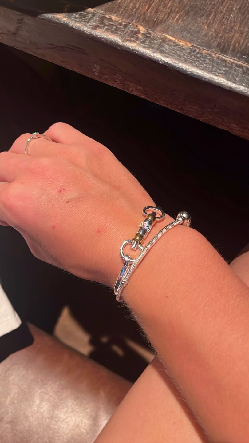 Customer photo review of Exclusive Sterling Silver & 18ct Gold Plate Cherry Roller Snaffle Bangle With Rainbow CZ Starlight Roller Bead