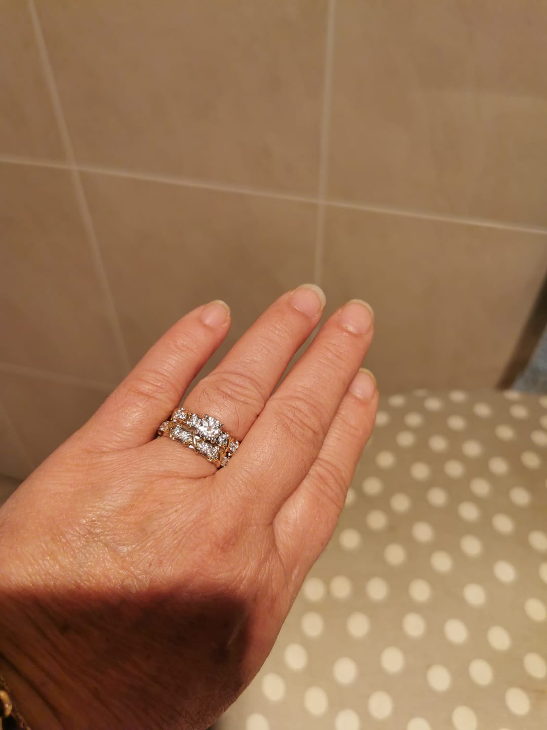 Customer photo review of Round Cut Moissanite Two-Tone Infinity Crisscross X Engagement Ring