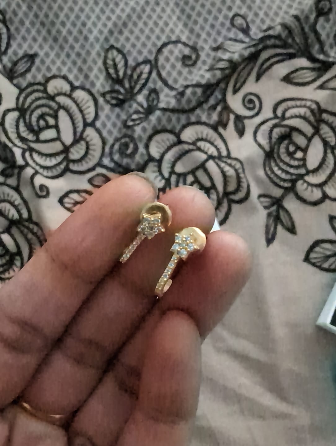 Customer photo review of Twinkle Curl Hoops in 92.5 Sterling Silver