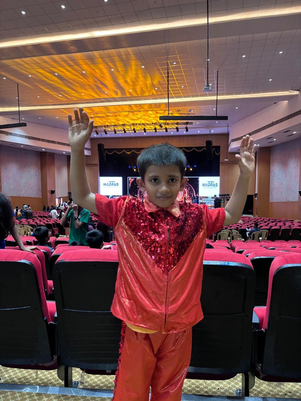 Customer photo review of Kids Shiny Orange Western Dance Dress Costume – Sequins Stage Performance Dress for Boys (Top & Pants Set)