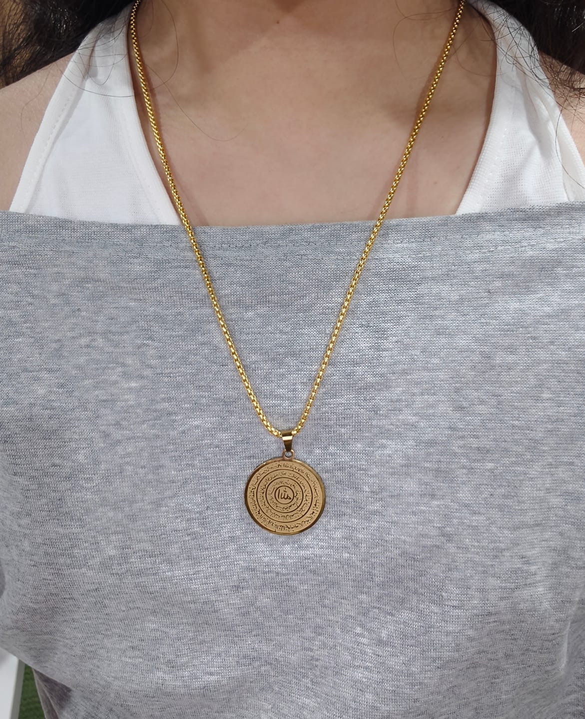 Customer photo review of HilalHaven Polished Round‑Disc with Circling Quranic‑Ayatul Kursi Verse Allah Necklace