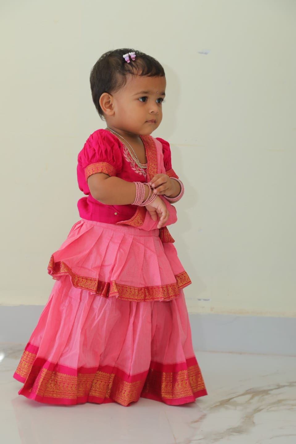 Customer photo review of Baby pink and festive pink traditional Ready to wear saree for Baby Girl /  Kids