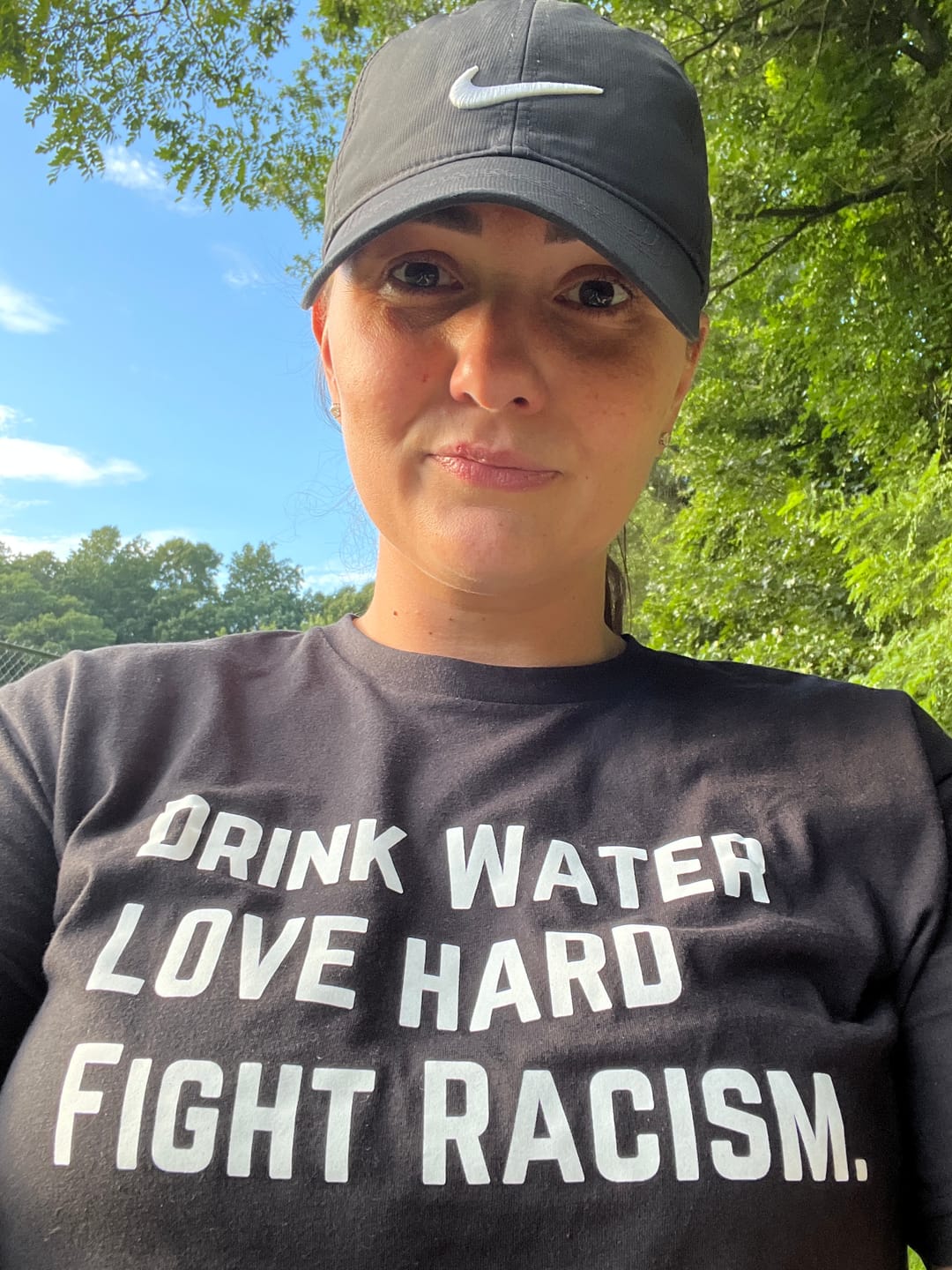 Customer photo review of Drink Water Fight Racism Unisex T-shirt